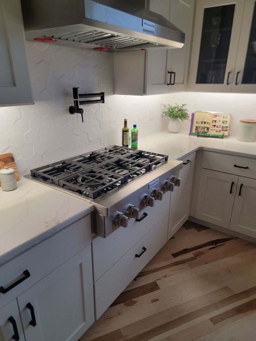 Emser white tile kitchen backsplash. 
